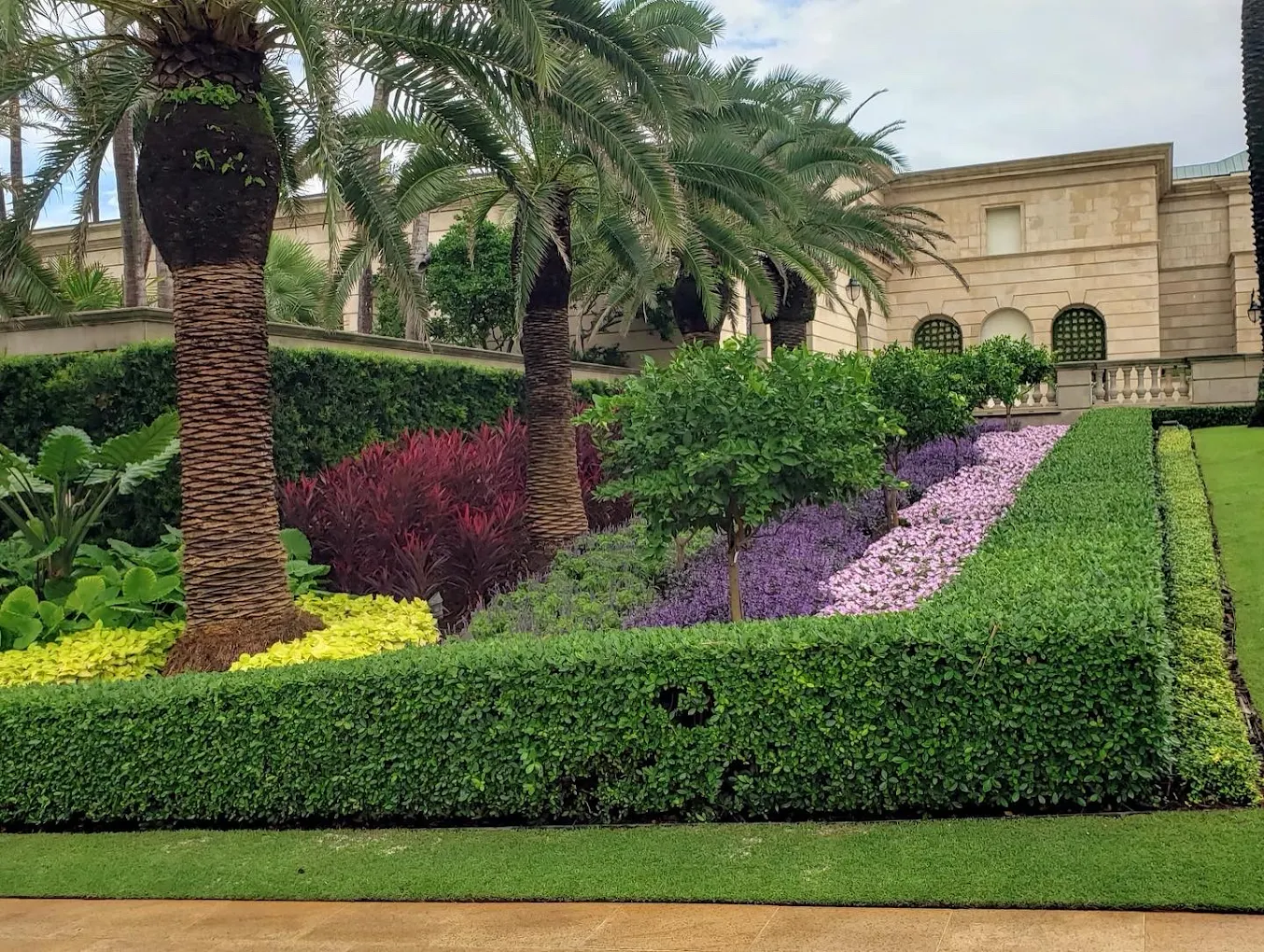 Luxury estate with dramatic colorful landscaping and purple flowers